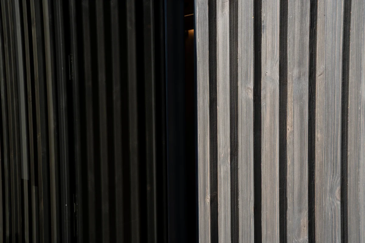 Thermally treated wood and composite cladding comparison on exterior wall