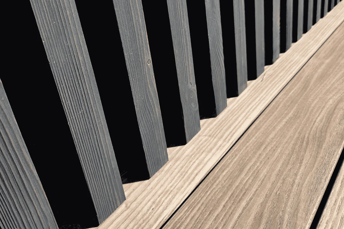 Oiled and natural thermo wood cladding in a modern facade and terrace design.