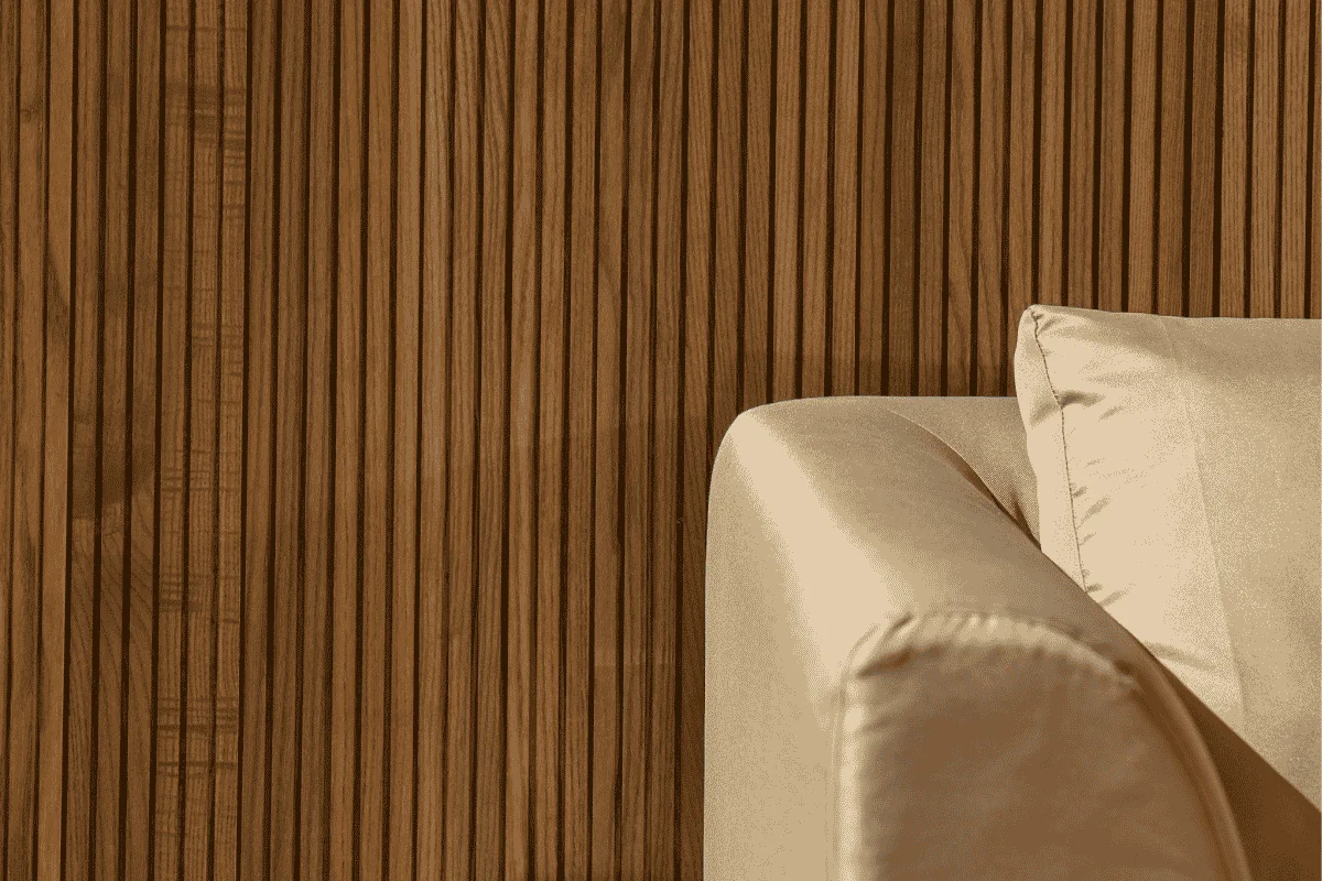 Wood cladding accent wall in a modern interior with natural wood texture.